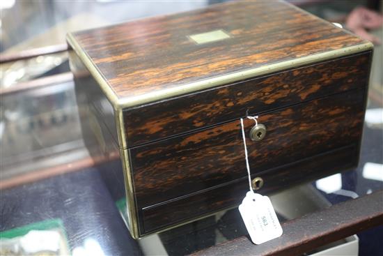 A Victorian brass mounted coromandel wood travelling toilet box containing ten silver mounted bottles/jars, 30.5cm.